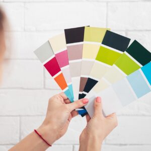 Close up of female with color pallets choosing color